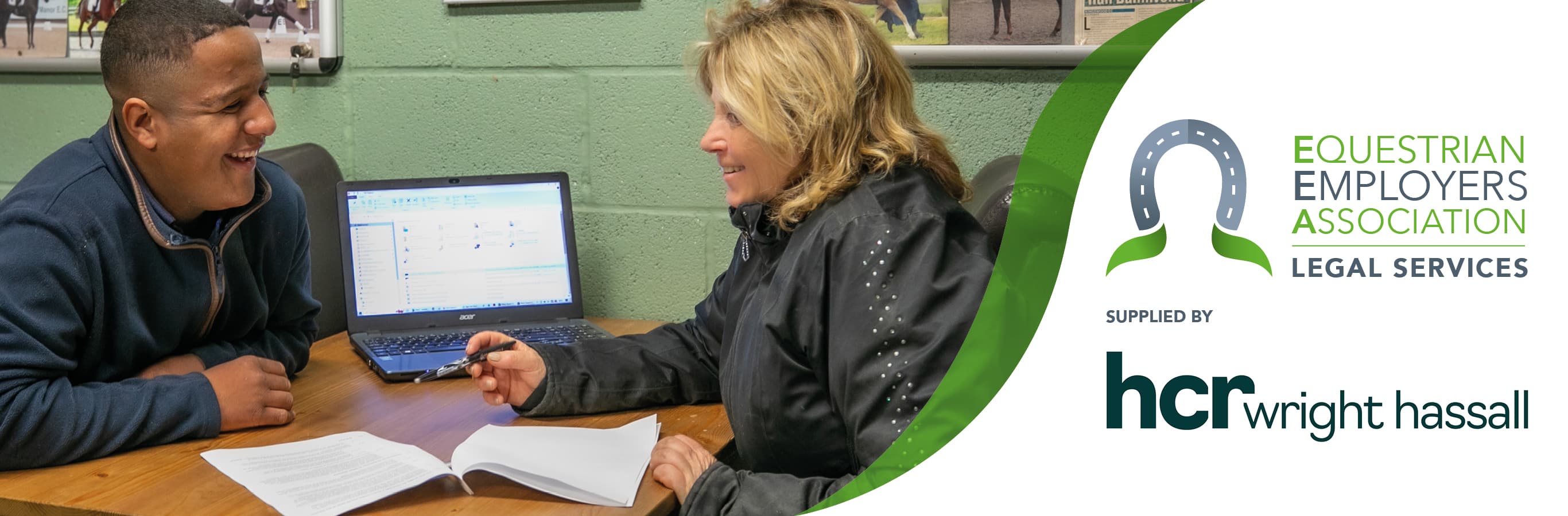 People talking over desk